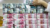 Теперь легли под юань: экономист оценил идею замены валюты из США на китайскую